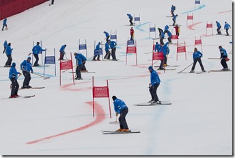 Course workers repair the piste between runs at the team event a parallel slalom race at the 2011 Alpine skiing World Championships